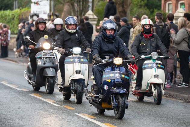 Scooter riders lead the funeral procession of Gary Mani Mounfield, Bass Player in the Stone Roses and Primal Scream, makes its way through Heaton Moor, Stockport on 22 December 2025. 22 12 2025 Stockport Greater Manchester England Heaton Moor  Copyright: xMattxWilkinsonx
