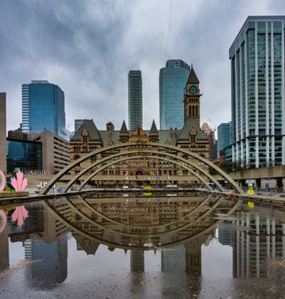 Nathan Phillips Square pond reflecting Old City Hall in Toronto Toronto, Ontario, Canada CR_UGOUSD251217-1909020-01
