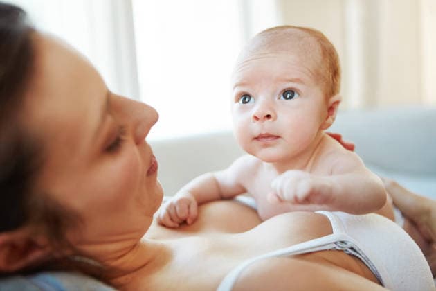 Relax, love and mom with newborn baby on sofa in home for connection, bonding and care. Development, family and mother in living room for holding infant, kid or child for growth together in apartment. model released property released Copyright: xx