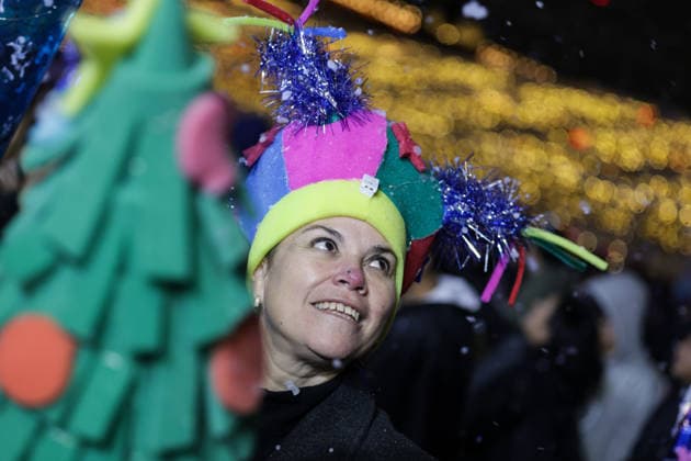 (251223) -- MEXICO CITY, Dec. 23, 2025 -- A visitor is pictured during a winter lights festival at the Zocalo square in Mexico City, Mexico, Dec. 22, 2025. A winter lights festival is held here to welcome the arrival of 2026. ) MEXICO-MEXICO CITY-WINTER LIGHTS FESTIVAL FranciscoxCanedo 