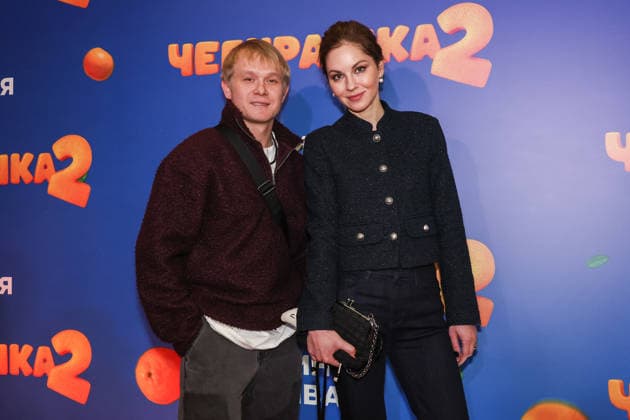 RUSSIA, MOSCOW - DECEMBER 24, 2025: Actors Vladimir Tyaptushkin and Marina Konyashkina pose on the red carpet during the premiere of the family comedy Cheburashka 2 by Dmitry Dyachenko at the KARO 11 Oktyabr cinema on Novy Arbat Street (New Arbat Avenue). Valery Sharifulin TASS  86692365