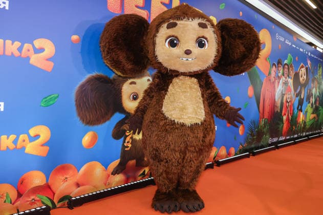 RUSSIA, MOSCOW - DECEMBER 24, 2025: An artist cosplays the title character on the red carpet during the premiere of the family comedy Cheburashka 2 by Dmitry Dyachenko at the KARO 11 Oktyabr cinema on Novy Arbat Street (New Arbat Avenue). Valery Sharifulin TASS  86691921