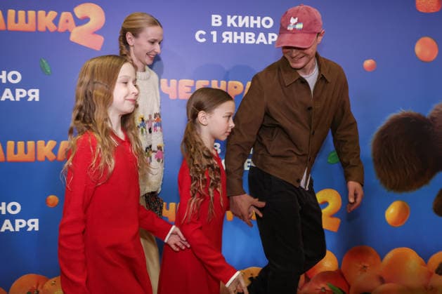 RUSSIA, MOSCOW - DECEMBER 24, 2025: Actor Yuri Borisov poses with his family on the red carpet during the premiere of the family comedy Cheburashka 2 by Dmitry Dyachenko at the KARO 11 Oktyabr cinema on Novy Arbat Street (New Arbat Avenue). Valery Sharifulin TASS  86692829