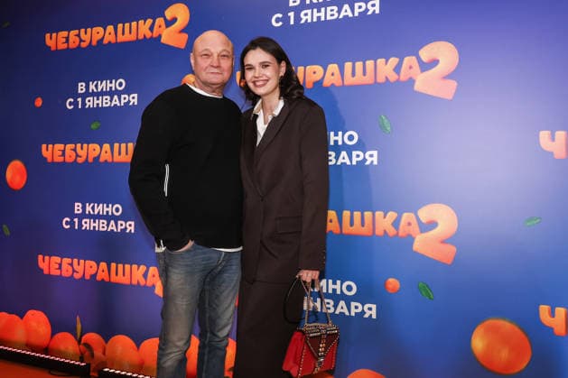 RUSSIA, MOSCOW - DECEMBER 24, 2025: Actor, producer, director Sergei Ginzburg poses with his wife Olga Vinichenko on the red carpet during the premiere of the family comedy Cheburashka 2 by Dmitry Dyachenko at the KARO 11 Oktyabr cinema on Novy Arbat Street (New Arbat Avenue). Valery Sharifulin TASS  86692120