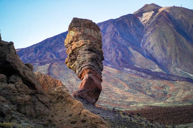 Beautiful cliff against the backdrop of Teide volcano and mountains. Roques de Garcia, picturesque Cinchado cliff against the backdrop of the Teide volcano at dusk, view of the mountains and volcanic lava formations and desert of the island of Tenerife, Canary Islands., 95566200.jpg RECORD DATE NOT STATED