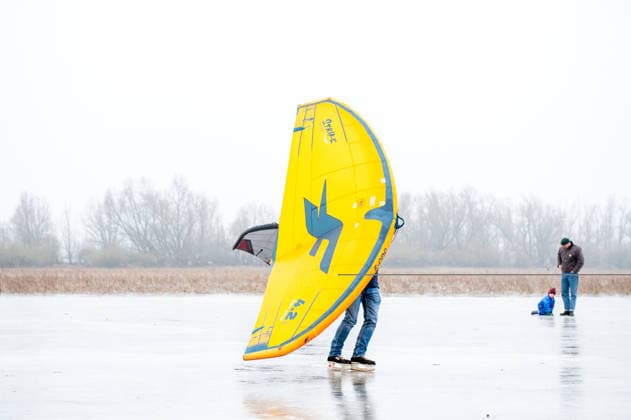 December 27, 2025, Nijmegen, Netherlands: A man is skating with the help of a wing. After several days of sub-zero temperatures during the night, the water of some lakes started to freeze over. People took the chance to skate on one of the frozen lakes close to the Dutch city of Nijmegen. It takes at least four whole days of below-freezing temperatures to form ice that™s safe to walk and skate on, and that only applies to ponds or lakes with no currents. Nijmegen Netherlands - ZUMAs197 20251227_aab_s197_053 Copyright: xAnaxFernandezx