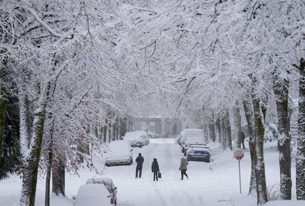 December 18, 2022, Vancouver, Bc, CANADA: People walk down the middle of a street as snow falls in Vancouver, on Sunday, December 18, 2022. Vancouver CANADA  - ZUMAc35_ 20221218_zaf_c35_153 Copyright: xDarrylxDyckx