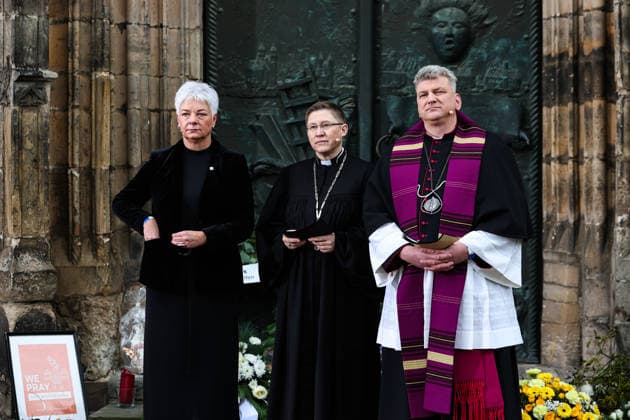 Mayor Regina Dolores Stieler Hinz, Regional Bishop Bettina Schlauraff, Cathedral Pastor Daniel Rudloff stand in front of St. Johns Church at the memorial site Memorial event in Magdeburg Saxony Anhalt , Churches and the state capital invite you to a memorial service in