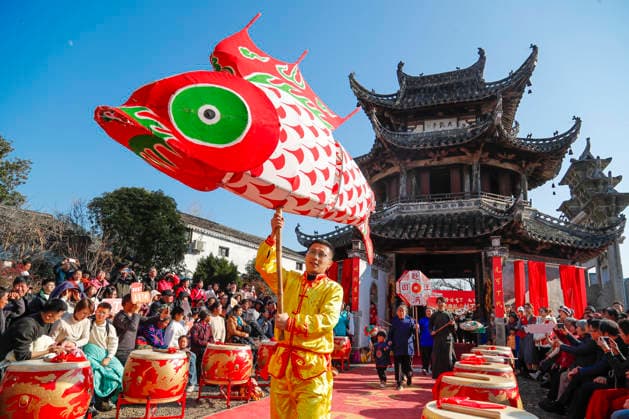 HUANGSHAN, CHINA - DECEMBER 28: A villager with a fish-shaped lantern walks on a catwalk during a village fashion show on December 28, 2025 in Shexian County, Huangshan City, Anhui Province of China. Nearly 200 villagers from 12 teams across Shexian County took center stage on the catwalk. They showcase various farming tools, agricultural products, cultural and tourism products through runway shows to greet the New Year.  Copyright: xVCGx 111612350748