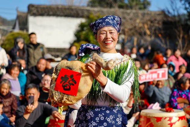 HUANGSHAN, CHINA - DECEMBER 28: A villager walks on a catwalk during a village fashion show on December 28, 2025 in Shexian County, Huangshan City, Anhui Province of China. Nearly 200 villagers from 12 teams across Shexian County took center stage on the catwalk. They showcase various farming tools, agricultural products, cultural and tourism products through runway shows to greet the New Year.  Copyright: xVCGx 111612350753