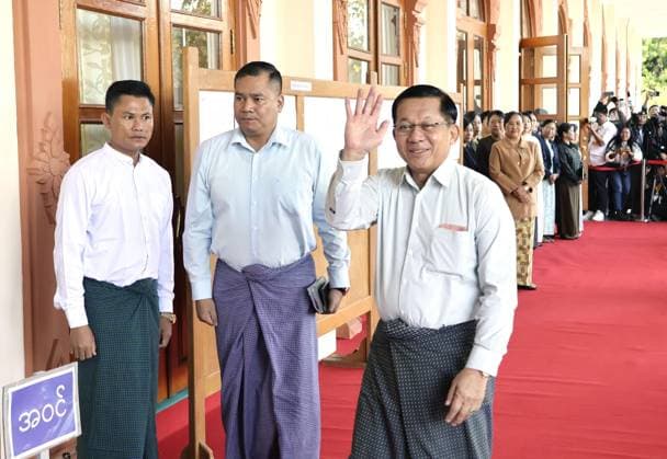 Myanmar s 1st general election since 2021 coup Senior Gen. Min Aung Hlaing, (R) who leads Myanmar s junta, arrives at a polling station in the capital Naypyitaw on Dec. 28, 2025, for the country s first general election since a 2021 coup.  A14AA0005142216P
