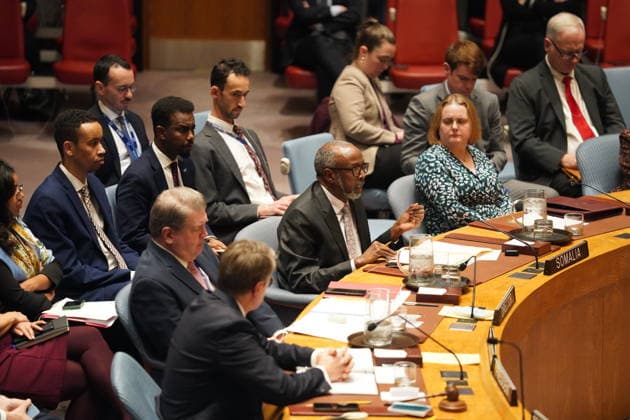 (251230) -- UNITED NATIONS, Dec. 30, 2025 -- Somali UN ambassador Abukar Dahir Osman (C, front) speaks at an emergency meeting of the Security Council at the UN headquarters in New York, on Dec. 29, 2025. The three African members of the Security Council -- Algeria, Sierra Leone, and Somalia -- along with Guyana, collectively known as A3+, on Monday strongly condemned Israel s recognition of Somaliland as a sovereign state. A3+ strongly condemns the flagrant assault by Israel on the unity and the territorial integrity of Somalia by recognizing as an independent entity the northwestern region of Somalia, the so-called Somaliland, said A3+ in a joint statement at an emergency meeting of the Security Council. ) UN-SECURITY COUNCIL-EMERGE 