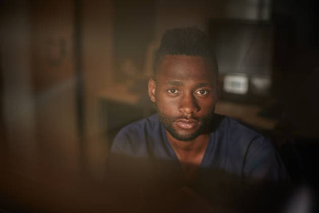 Black man, serious and portrait of doctor in hospital for healthcare or medical professional at night. African person, about us and physician for overtime, confidence and male surgeon in clinic. model released property released Copyright: xx