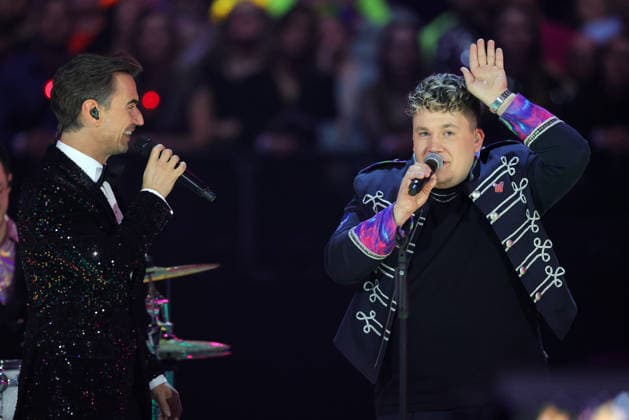 Silvester Schlagerboom 2026 live Die Wunderlichtershow Florian Silbereisen with Florian Hertel singer and frontman of the Cologne brass and performance band Druckluft Silvester Schlagerboom 2026 on December 31, 2025 in the basketball arena of FC Bayern Munich, BMW Park Munich