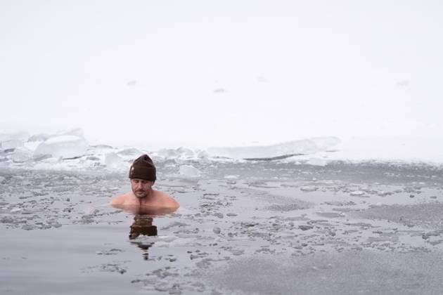 January 1, 2026, Dartmouth, Ns, Canada: A person stays still in the ice-filled water in Lake Banook during the annual polar bear swim on New Year s Day in Dartmouth, N.S., Thursday, Jan. 1, 2026. Dartmouth Canada  - ZUMAc35_ 20260101_zaf_c35_016 Copyright: xDarrenxCalabresex