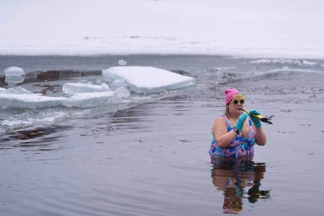 January 1, 2026, Dartmouth, Ns, Canada: A person wears New Year s paraphernalia while swimming in the ice-filled water in Lake Banook during the annual polar bear swim on New Year s Day in Dartmouth, N.S., Thursday, Jan. 1, 2026. Dartmouth Canada  - ZUMAc35_ 20260101_zaf_c35_015 Copyright: xDarrenxCalabresex