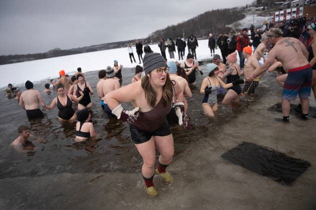 January 1, 2026, Dartmouth, Ns, Canada: People react to entering the ice-filled water in Lake Banook during the annual polar bear swim on New Year s Day in Dartmouth, N.S., Thursday, Jan. 1, 2026. Dartmouth Canada  - ZUMAc35_ 20260101_zaf_c35_021 Copyright: xDarrenxCalabresex