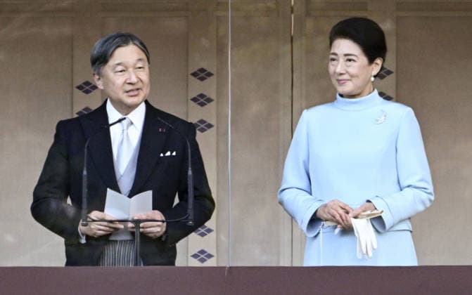 New Year greeting event at Japan s Imperial Palace Japanese Emperor Naruhito speaks to well-wishers from a balcony at the Imperial Palace in Tokyo during a New Year greeting event on Jan. 2, 2026. Standing next to him is Empress Masako.  A14AA0005146711P