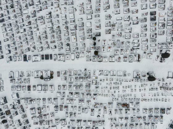 Snowstorms hit Poland NOWY TARG, POLAND - JANUARY 02 : An aerial view of a cemetery covered with snow in Nowy Targ, Poland on January 02, 2026. According to the Polish Institute of Meteorology, several weather alerts have been issued due to strong winds and heavy snowfall expected to reach 20 to 30 cm in some parts of Poland. The snowstorms and freezing clod is expected to continue trought the next days all over the country. Omar Marques Anadolu Zakopane Poland. Editorial use only. Please get in touch for any other usage.  Copyright: x2026xAnadoluxOmarxMarquesx