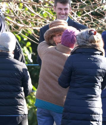 A member of the public gets a hug from Queen Camilla. King Charles III and Queen Camilla, attended the Sunday morning service at St. Mary Magdalene church in Sandringham. King Charles III, Sandringham, Norfolk, on 4th January, 2026 