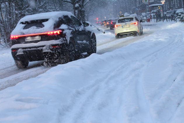 Driving snow on Thursday morning in Hamburg Cars struggle across a road covered in snow Barmbek Hamburg