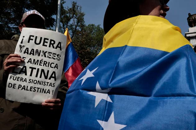 January 10, 2026, Mexico City, Cdmx, Mexico: Mexican protesters and social organizations are demonstrating against the actions of US President DONALD TRUMP against Venezuela and its former president, NICOLAS MADURO. With posters, giant banners, and Venezuelan flags, they are showing their support for MADURO and his vice president, DELCY RODRIGUEZ, who has assumed the presidency due to the country s situation. Chanting slogans like Yankees out of Latin America and Trump, imperialist terrorist, the protesters are demanding the immediate release of NICOLAS MADURO, whom they claim is being held captive by DONALD TRUMP. This comes as protests against these actions spread worldwide, with many believing TRUMP S true objective is to seize V - ZUMAp204 20260110_zip_p204_042 Copyright: xJosuexPerezx