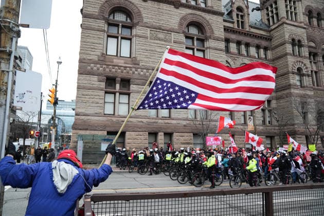 11 arrested at anti-immigration rally and counter-demonstration in Toronto TORONTO, CANADA - JANUARY 10 : A demonstrator holds an upside-down US flag as Canada First protestors wave Canadian flags during a rally in Toronto, Ontario on January 10, 2026. Canada First protestors and counter demonstrators gathered at Nathan Phillips Square and marched in downtown Toronto. Clashes broke out between police and protesters, eleven protesters arrested. Mert Alper Dervis Anadolu Ontario Canada. Editorial use only. Please get in touch for any other usage.  Copyright: x2026xAnadoluxMertxAlperxDervisx