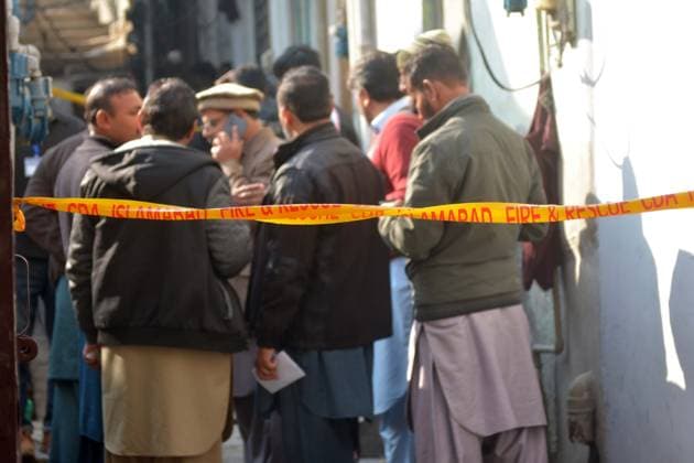 (260111) -- ISLAMABAD, Jan. 11, 2026 -- Locals gather near the site of a gas explosion in Islamabad, capital of Pakistan on Jan. 11, 2026. The death toll from a gas explosion at a wedding house in Pakistan s federal capital, Islamabad, has risen to eight, including a newlywed couple, while 11 others were injured, local authorities said on Sunday. Rescue officials said at least four houses in the surrounding area were affected by the blast. Authorities said the exact cause of the explosion will be determined following a detailed investigation. (Str Xinhua) PAKISTAN-ISLAMABAD-GAS EXPLOSION-AFTERMATH AhmadxKamal 