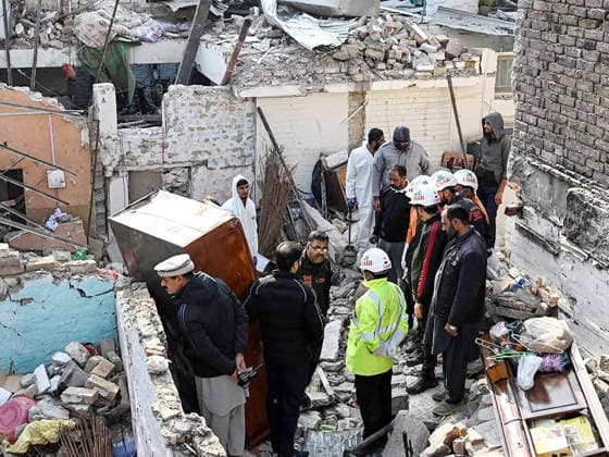 (260111) -- ISLAMABAD, Jan. 11, 2026 -- Security personnel examine the site of a gas explosion in Islamabad, capital of Pakistan on Jan. 11, 2026. The death toll from a gas explosion at a wedding house in Pakistan s federal capital, Islamabad, has risen to eight, including a newlywed couple, while 11 others were injured, local authorities said on Sunday. Rescue officials said at least four houses in the surrounding area were affected by the blast. Authorities said the exact cause of the explosion will be determined following a detailed investigation. (Str Xinhua) PAKISTAN-ISLAMABAD-GAS EXPLOSION-AFTERMATH AhmadxKamal 