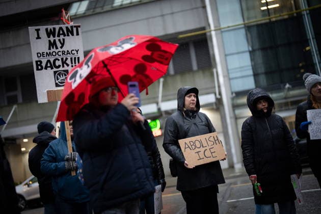 January 11, 2026, Vancouver, Bc, CANADA: People gather to demonstrate during an Ice Out For Good rally outside of the U.S. Consulate General office in Vancouver, on Sunday, January 11, 2026. Vancouver CANADA  - ZUMAc35_ 20260111_zaf_c35_041 Copyright: xEthanxCairnsx