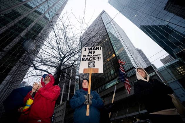 January 11, 2026, Vancouver, Bc, CANADA: People gather to demonstrate during an Ice Out For Good rally outside of the U.S. Consulate General office in Vancouver, on Sunday, January 11, 2026. Vancouver CANADA  - ZUMAc35_ 20260111_zaf_c35_044 Copyright: xEthanxCairnsx