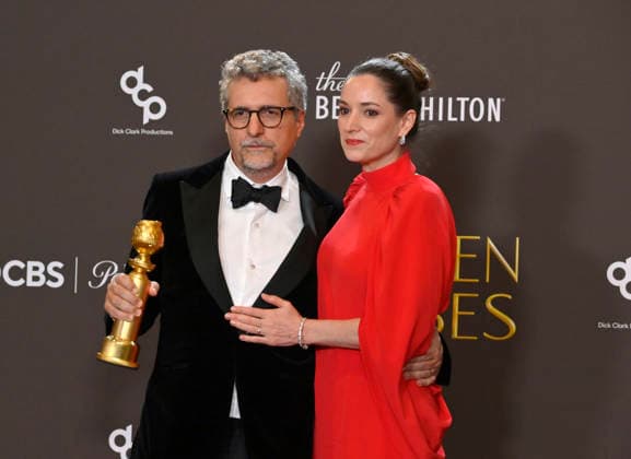 Kleber Mendonça Filho and Emilie Lesclaux appear backstage after winning the award for Best Motion Picture – Non-English Language award for The Secret Agent during the 83rd annual Golden Globe Awards at the Beverly Hilton in Beverly Hills, California on Sunday, January 11, 2026.  LAP20260111712 JIMxRUYMEN