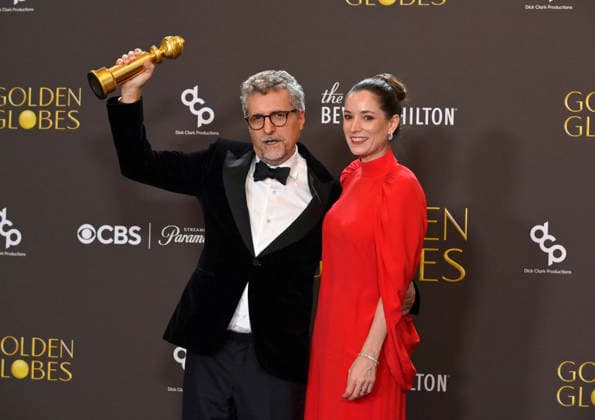 Kleber Mendonça Filho and Emilie Lesclaux appear backstage after winning the award for Best Motion Picture – Non-English Language award for The Secret Agent during the 83rd annual Golden Globe Awards at the Beverly Hilton in Beverly Hills, California on Sunday, January 11, 2026.  LAP20260111713 JIMxRUYMEN