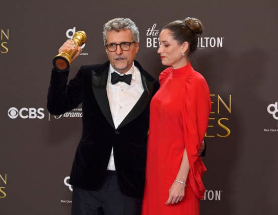 Kleber Mendonça Filho and Emilie Lesclaux appear backstage after winning the award for Best Motion Picture – Non-English Language award for The Secret Agent during the 83rd annual Golden Globe Awards at the Beverly Hilton in Beverly Hills, California on Sunday, January 11, 2026.  LAP20260111714 JIMxRUYMEN