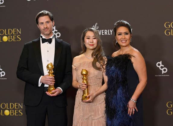 Chris Appelhans, Maggie Kang, and Michelle Wong appear backstage after winning the award for Best Motion Picture - Animated award for KPop Demon Hunters during the 83rd annual Golden Globe Awards at the Beverly Hilton in Beverly Hills, California on Sunday, January 11, 2026.  LAP20260111725 JIMxRUYMEN