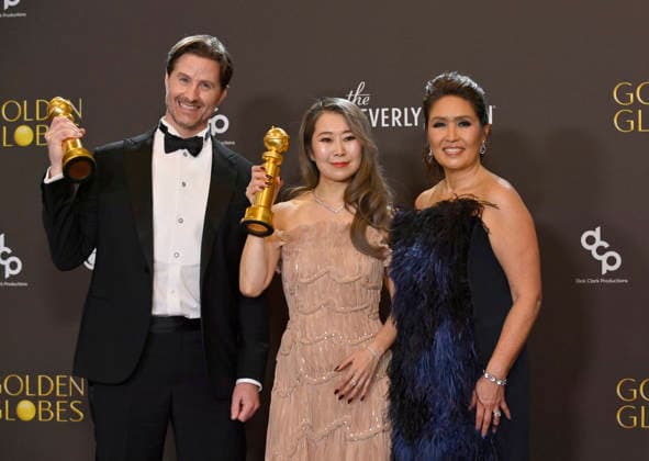 Chris Appelhans, Maggie Kang, and Michelle Wong appear backstage after winning the award for Best Motion Picture - Animated award for KPop Demon Hunters during the 83rd annual Golden Globe Awards at the Beverly Hilton in Beverly Hills, California on Sunday, January 11, 2026.  LAP20260111726 JIMxRUYMEN