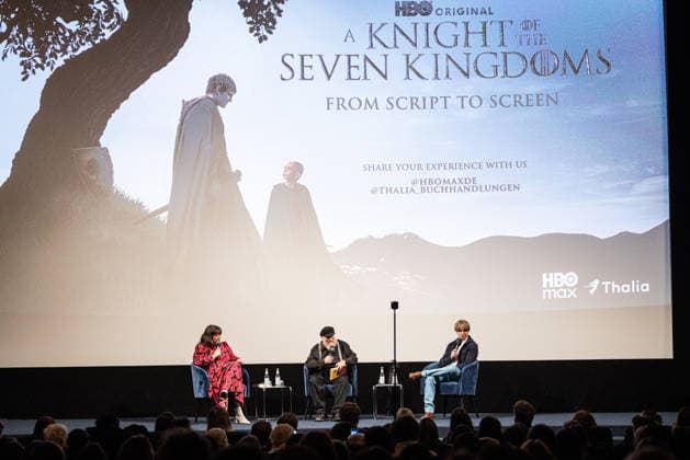Fan event A KNIGHT OF THE SEVEN KINGDOMS Presenter Marie Christine Knop on stage with George R R Martin Writer Executive Producer and Ira Parker Co Creator Showrunner Executive Producer Fan event Reading and Q A Script to Screen from A KNIGHT OF THE SEVEN KINGDOMS at the Delphi Cinema in Berlin Date 12 01 2026 Copyright: xEventpressxFuhrx