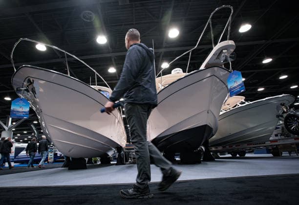 (260115) -- VANCOUVER, Jan. 15, 2026 -- A man walks past yachts on display during the Vancouver International Boat Show 2026 at the Vancouver Convention Centre in Vancouver, British Columbia, Canada, Jan. 14, 2026. The five-day show kicked off here on Wednesday, with hundreds of exhibitors from around the world showcasing the latest vessels, marine gears and marine technology. (Photo by Xinhua) CANADA-VANCOUVER-INT L BOAT SHOW 2026 LiangxSen 