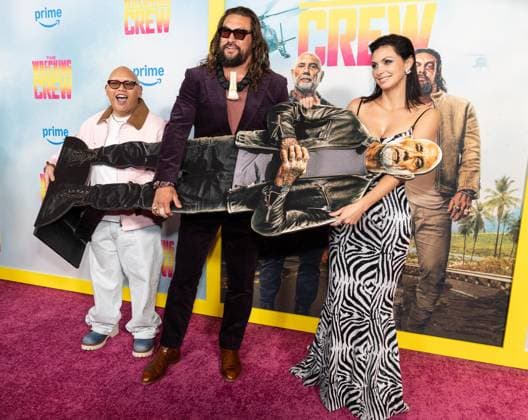 January 15, 2026, Bronx, New York, USA: Jacob Batalon, Jason Momoa holding cutout of Dave Bautista, who did not attend, and Morena Baccarin attend special screening of The Wrecking Crew at Regal Times Square in New York, NY on January 15, 2026 Bronx USA - ZUMAr339 20260115_znp_r339_051 Copyright: xLevxRadinx