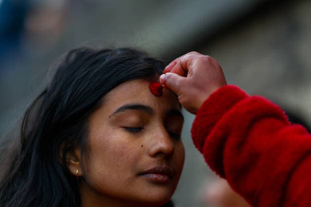 (260118) -- KATHMANDU, Jan. 18, 2026 -- A devotee performs a ritual during the month-long Madhav Narayan Festival at Pashupatinath Temple in Kathmandu, Nepal, Jan. 18, 2026. The festival is observed through fasting and praying to Goddess Swasthani and God Madhav Narayan. (Photo by Xinhua) NEPAL-KATHMANDU-MADHAV NARAYAN FESTIVAL SulavxShrestha 
