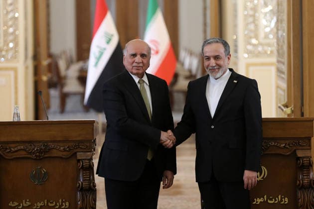 Iraqi and Iranian Foreign Ministers meet in Tehran TEHRAN, IRAQ - JANUARY 18: Iraqi Foreign Minister Fuad Hussein (L) and his Iranian counterpart Abbas Araghchi (R) hold a joint press conference after their meeting at the Ministry of Foreign Affairs in Tehran, Iran on January 18, 2026. Fatemeh Bahrami Anadolu Tehran Iran. Editorial use only. Please get in touch for any other usage.  Copyright: x2026xAnadoluxFatemehxBahramix