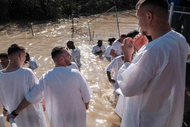 January 19, 2026, Jordan Valley, Israel: Faithful believers of the Syriac, Coptic and Ethiopian Orthodox Churches celebrate Epiphany at the Jordan River Qasr Al Yahud baptism site near the West Bank city of Jericho, where tradition places the baptism of Jesus by John the Baptist, seen as his manifestation to the world as the Son of God. Jordan Valley - ZUMAa126 20260119_zap_a126_014 Copyright: xNirxAlonx
