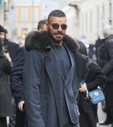 Milan: Ricky Martin leaves the Armani Hotel to go to the fashion show, followed by bodyguards, a huge crowd of photographers, cameramen, and fans.  Copyright: xMimmoxCarrierox xipa-agency.netx xMIMMOxCARRIERO-x IPA_Agency_IPA70291364
