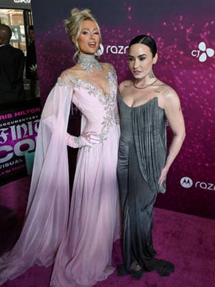 Infinite Icon: A Visual Memoir Premiere in Los Angeles #2 January 20, 2026, Los Angeles, California, USA: PARIS HILTON and DEMI LOVATO attends the Los Angeles World Red Carpet Premiere Of Infinite Icon Los Angeles USA - ZUMAb173 20260120_aap_b173_034 Copyright: xBillyxBennightx