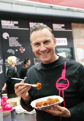 21 01 2026, Berlin Germany Green Week, Tim Raue with his currywurst from the Sphere in the TV tower