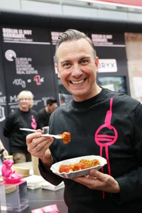 21 01 2026, Berlin Germany Green Week, Tim Raue with his currywurst from the Sphere in the TV tower