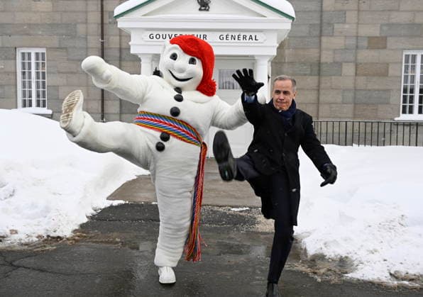 January 22, 2026, Quebec, Pq, Canada: Prime Minister Mark Carney, right, and Bonhomme Carnaval raise their legs together in a traditional carnival kick, at the beginning of a Cabinet planning forum at the Citadelle in Quebec City, Thursday, Jan. 22, 2026. Quebec Canada  - ZUMAc35_ 20260122_zaf_c35_018 Copyright: xJacquesxBoissinotx