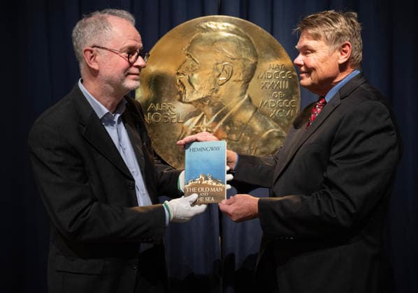 Stockholm 20260123 American Hemingway connoisseur Curtis DeBerg hands over the Hemingway book The Old Man and the Sea to Nobel Prize Museum curator Ulf Larsson The book h  Copyright: xFredrikxSandberg TTx HEMINGWAYBOK hrW8lC31xXk