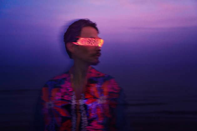 Person wearing VR glasses with cyberpunk glitch effect at night model released, Symbolfoto, AZF01123