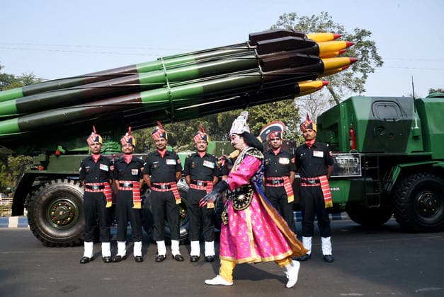 An artist dressed as Ravana walks past army personnel and a rocket launcher vehicle during a Republic Day parade rehearsal Kolkata, Jan 24 (ANI): An artist dressed as Ravana walks past army personnel and a rocket launcher vehicle during the Republic Day parade rehearsal at Red Road, in Kolkata on Saturday. Kolkata West Bengal India Copyright: xANIx ANI_20260124014